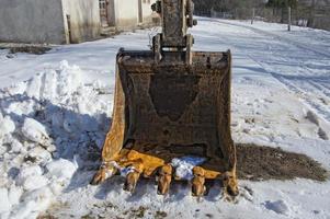 escavator hard used rusted bucket photo