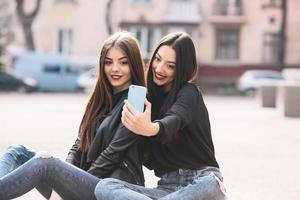 Two young adult girls photo