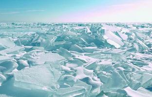 Cracked ice surface from frozen water in lake of Baikal in winter season. photo