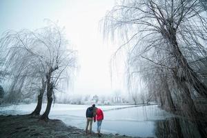 Couple in winter landscape photo