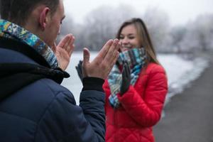 Couple in winter landscape photo