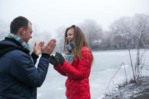 Couple in winter landscape photo