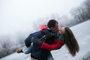 Couple in winter landscape photo