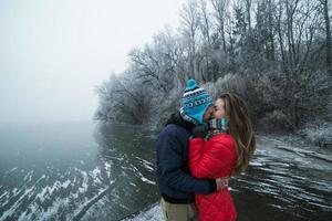 Couple in winter landscape photo