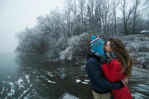 Couple in winter landscape photo