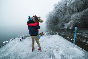 Couple in winter landscape photo