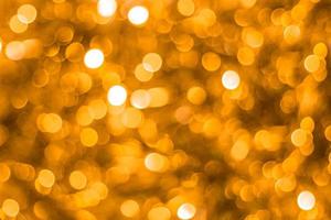 gold abstract background with bokeh defocused lights photo