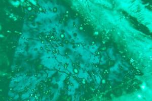 Blurred abstract background of aqua menthe color and blue. photo