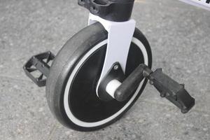 Close-up of children's tricycle wheel photo