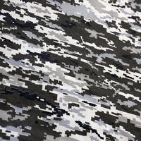 Fabric with texture of Ukrainian military pixeled camouflage. Cloth with camo pattern in grey, brown and green pixel shapes. Official uniform of Ukrainian soldiers photo