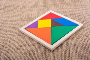 Pieces of a square tangram puzzle photo