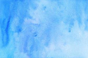 Watercolor blue ombre background texture. Watercolour deep blue gradient. Stains on paper. photo