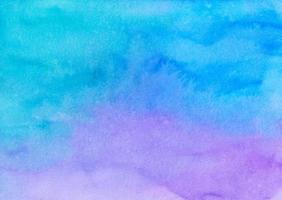 Watercolor light blue and purple ombre background painting texture. Multicolored pastel watery soft backdrop. Stains on paper. photo