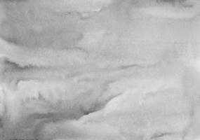 Manchas grises tranquilas de acuarela sobre textura de fondo de papel. superposición de fondo monocromo. acuarela abstracta pintura moderna en blanco y negro. foto