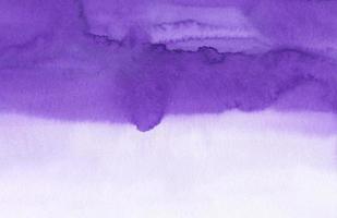 Watercolor violet and white soft background texture. Stains on paper. Aquarelle purple ombre backdrop. photo