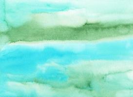 Watercolor light blue and green background texture. Multicolored soft backdrop, hand painted. Stains on paper. photo