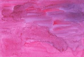 Watercolor deep pink background painting. Rose color liquid backdrop. Stains on paper. photo