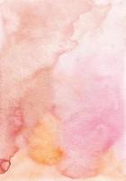 Abstract pastel pink and orange watercolor background texture, hand painted. Artistic light red and yellow backdrop, stains on paper. Aquarelle painting wallpaper. photo