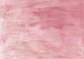 textura de fondo grunge acuarela rosa abstracta, pintada a mano. telón de fondo texturizado de color rosa polvoriento artístico. fondo de pantalla de pintura de acuarela. foto