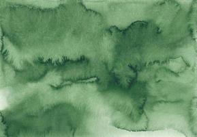 Abstract green watercolor background texture, hand painted. Artistic emerald color backdrop, stains on paper. Aquarelle painting wallpaper. photo