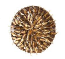 Top view of salted dried fish arrange on bamboo wicker isolated on white background photo