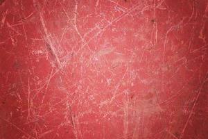 Scratch blank red grunge metal  surface as dark texture background with spot and vignette border. photo