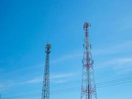 Telephone tower On the background is a bright blue sky. photo