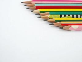 A pencil arranged in a row on a white background photo