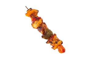 Grilled pork skewer and vegetables barbecue isolated on white background photo