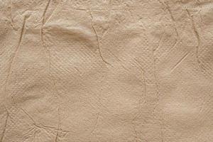 Crumpled brown recycle tissue paper texture abstract background photo