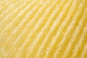 Potato chip texture background closeup photo