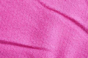 Fondo de primer plano de textura de tela de algodón rosa foto