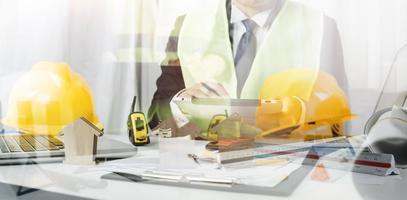 Scene of industrial engineers discussion, Construction architect with huge industry as a background, Concept of engineer project planning, professional teamwork. Selective focused. photo