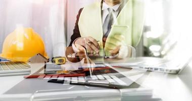 Scene of industrial engineers discussion, Construction architect with huge industry as a background, Concept of engineer project planning, professional teamwork. Selective focused. photo