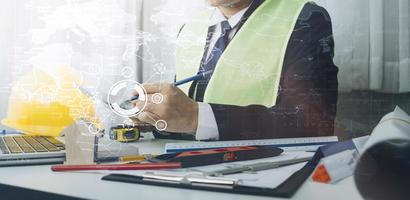 Scene of industrial engineers discussion, Construction architect with huge industry as a background, Concept of engineer project planning, professional teamwork. Selective focused. photo