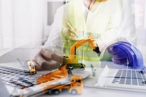Scene of industrial engineers discussion, Construction architect with huge industry as a background, Concept of engineer project planning, professional teamwork. Selective focused. photo