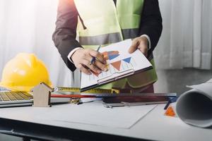 Scene of industrial engineers discussion, Construction architect with huge industry as a background, Concept of engineer project planning, professional teamwork. Selective focused. photo