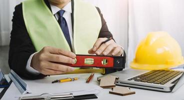 Scene of industrial engineers discussion, Construction architect with huge industry as a background, Concept of engineer project planning, professional teamwork. Selective focused. photo