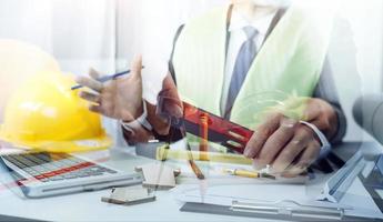 Scene of industrial engineers discussion, Construction architect with huge industry as a background, Concept of engineer project planning, professional teamwork. Selective focused. photo