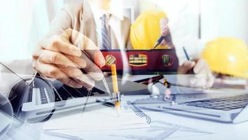 Scene of industrial engineers discussion, Construction architect with huge industry as a background, Concept of engineer project planning, professional teamwork. Selective focused. photo