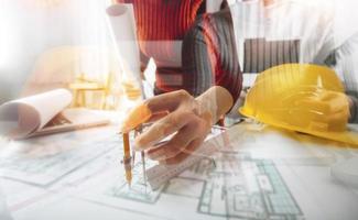 Scene of industrial engineers discussion, Construction architect with huge industry as a background, Concept of engineer project planning, professional teamwork. Selective focused. photo