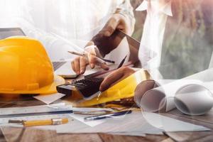 Scene of industrial engineers discussion, Construction architect with huge industry as a background, Concept of engineer project planning, professional teamwork. Selective focused. photo