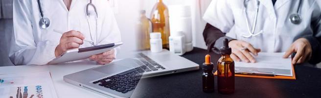 Medicine doctor and stethoscope touching icon medical network connection with modern interface on digital tablet in hospital background. Medical technology network concept photo