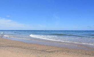 Ocean Waves Lapping the Shore Along Cape Cod photo
