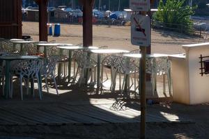 White metal tables and chairs for outdoor and garden use photo