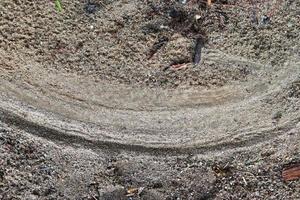 Detailed close up view on a brown sand ground texture photo