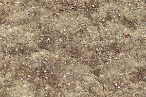 Detailed close up view on a brown sand ground texture photo