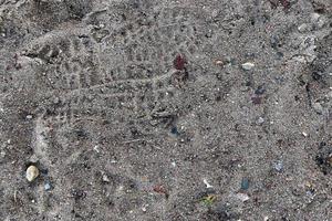 Detailed close up view on a brown sand ground texture photo