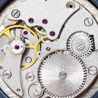 gray clockwork of old mechanical watch photo