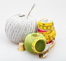 needlework objects on gray background photo